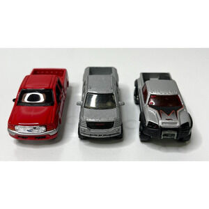 Lot of 3 Metal Diecast Trucks Models: Ford F- Series GMC Terradyne Mega Duty